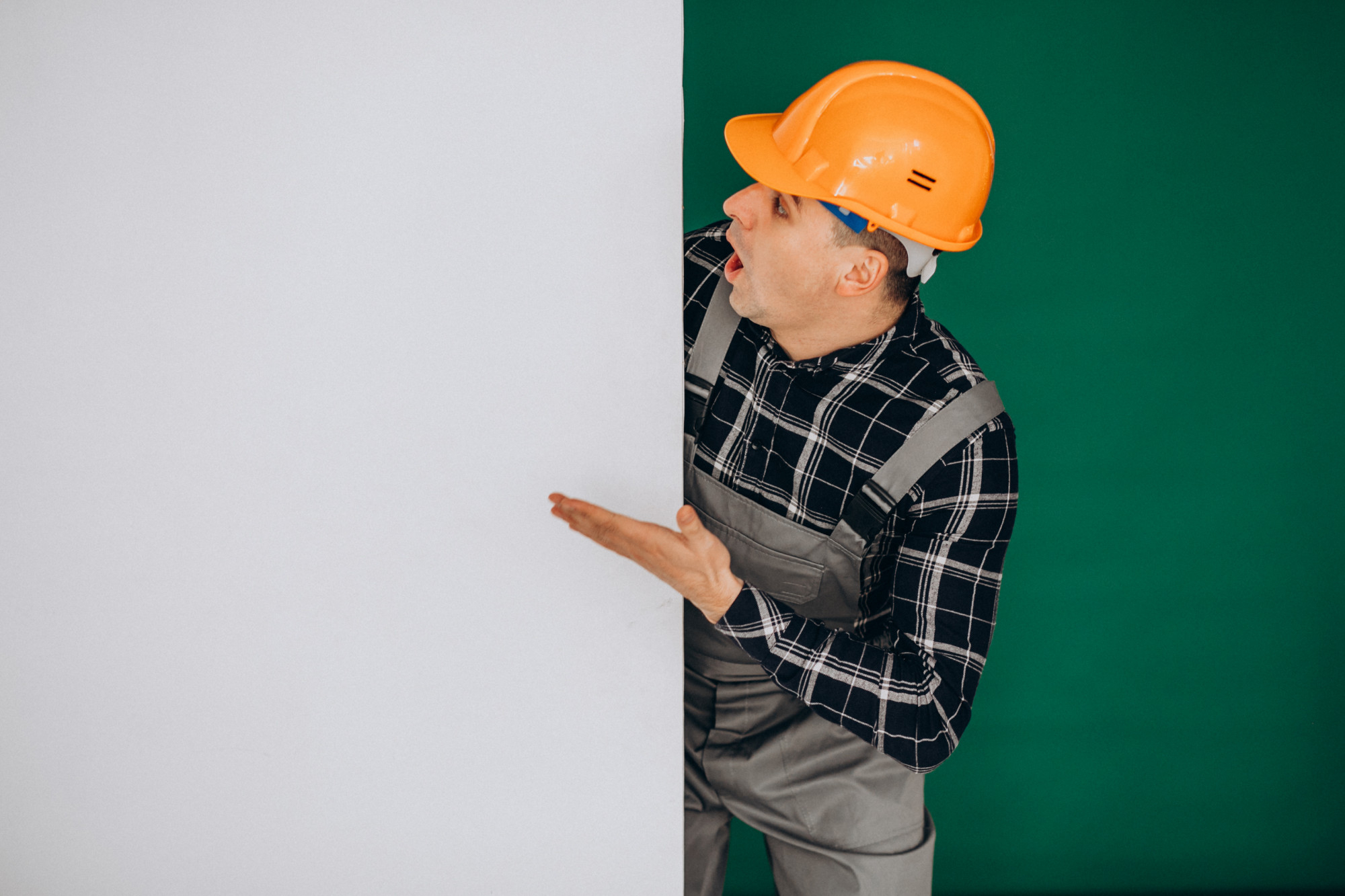 man-worker-hard-hat-isolated-green-wall